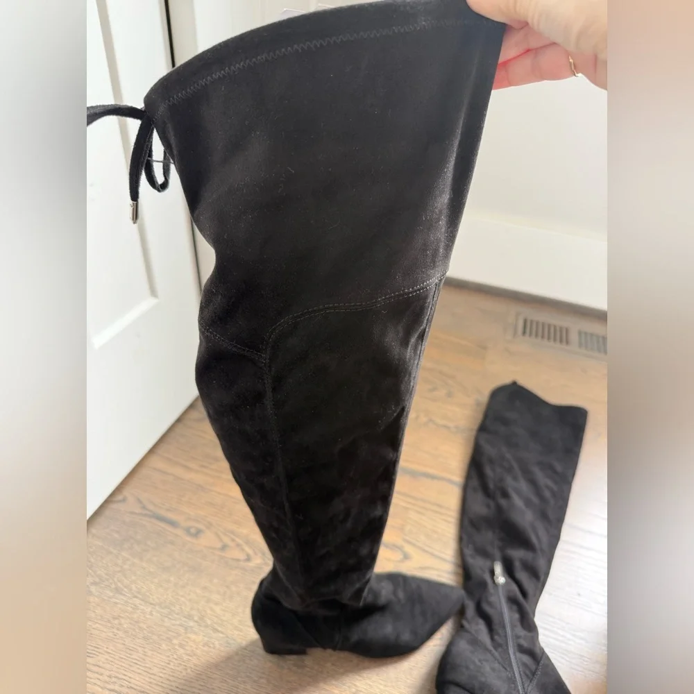 Marc Fisher black faux suede over-the-knee boots with a block heel and tie-back.